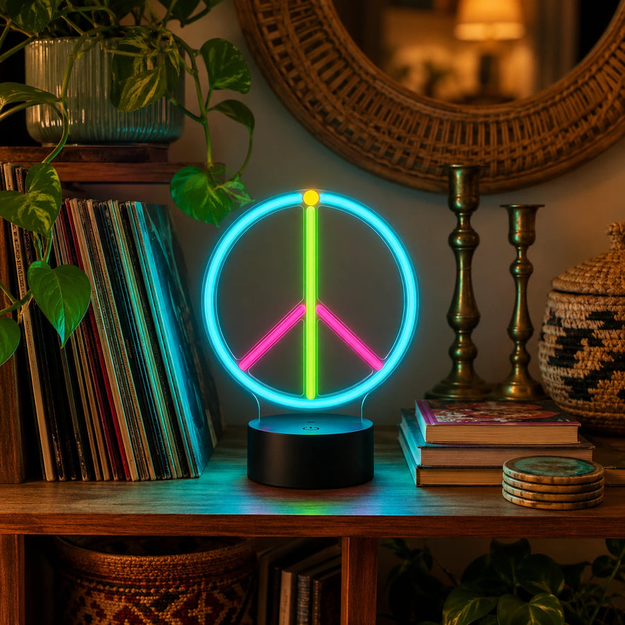 Peace symbol neon desk light glowing on a wooden shelf beside records and books