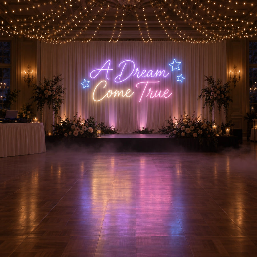 A Dream Come True wedding neon sign in purple, warm white, pink and blue for dance floor