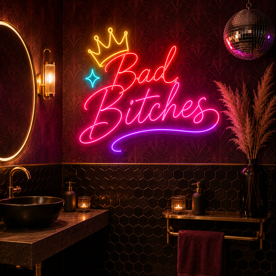 Bad Bitches neon sign glowing in a bathroom powder room