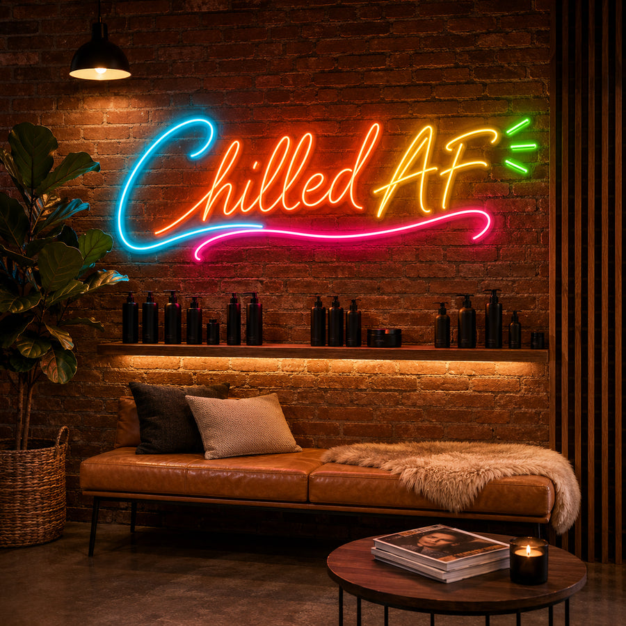 Chilled AF neon sign glowing on a brick wall in a lounge