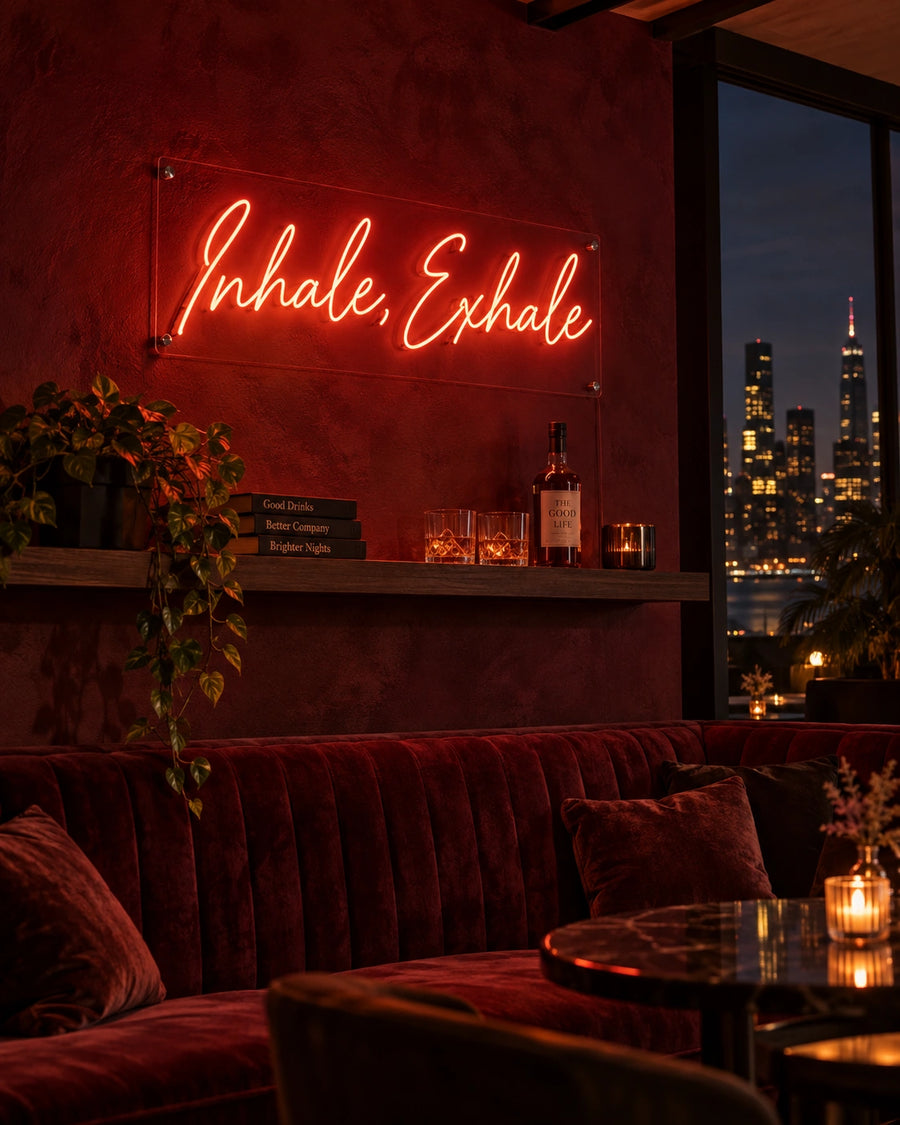Inhale Exhale red LED neon sign on a dark wall in a lounge bar