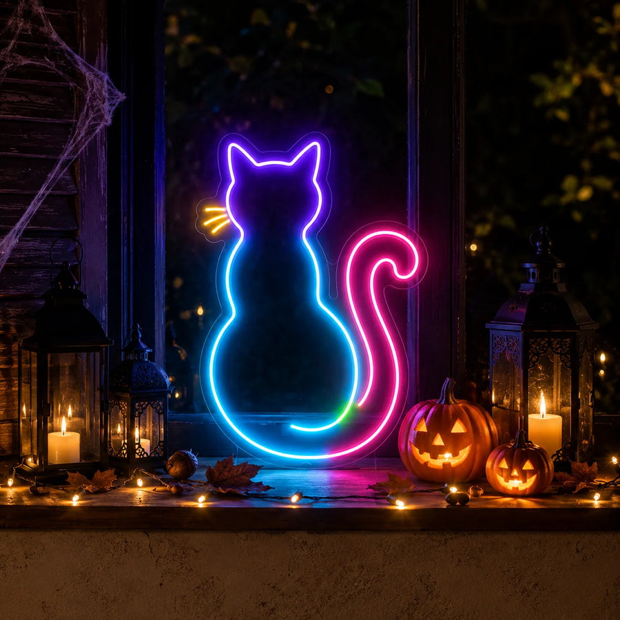 Neon cat Halloween sign glowing on a windowsill with autumn decor