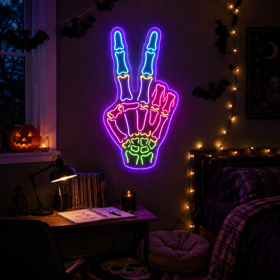Neon skeleton sign glowing in a bedroom studio with dark Halloween styling