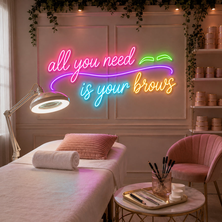 All You Need Is Your Brows neon sign glowing in a brow bar