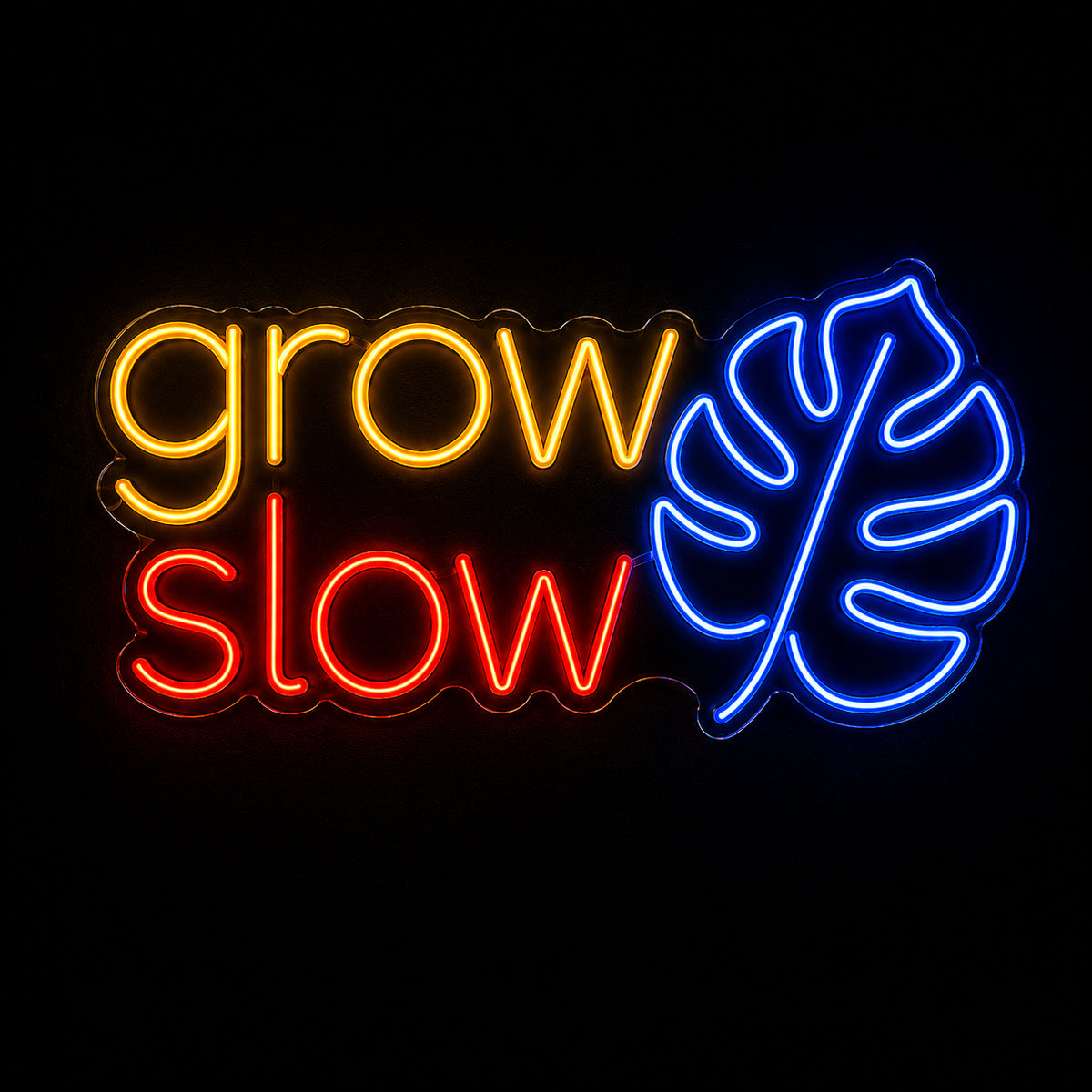 Grow Slow LED neon sign with monstera leaf by Fineyst Neon in Yellow, Red & Blue on clear acrylic
